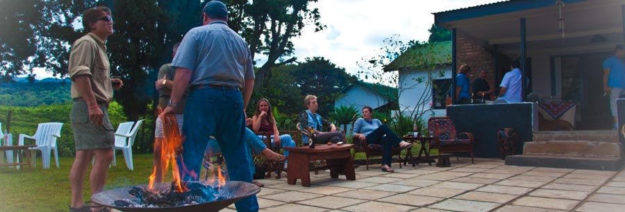 Guests gathering on the cottage patio with highland views